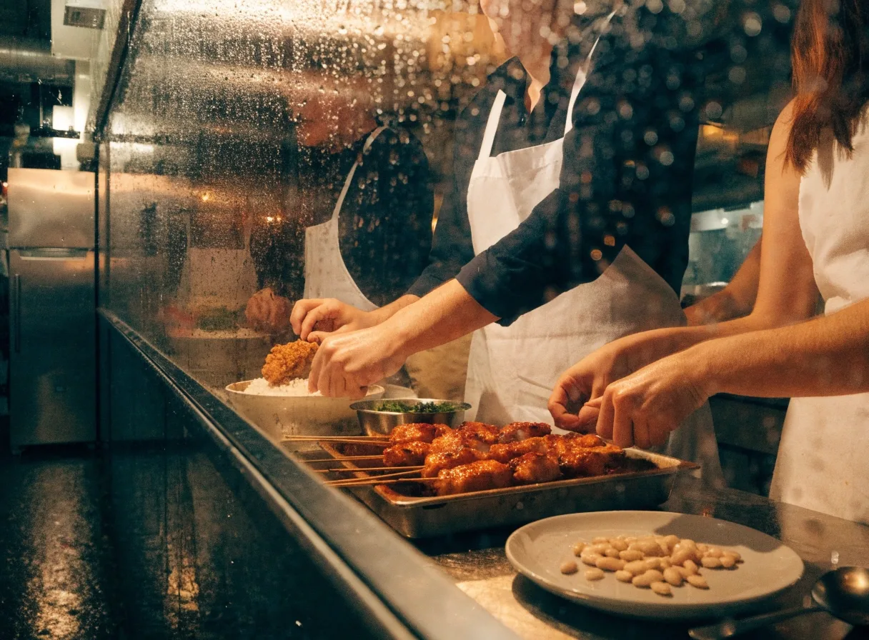 Warm restaurant glow seen through glass at night